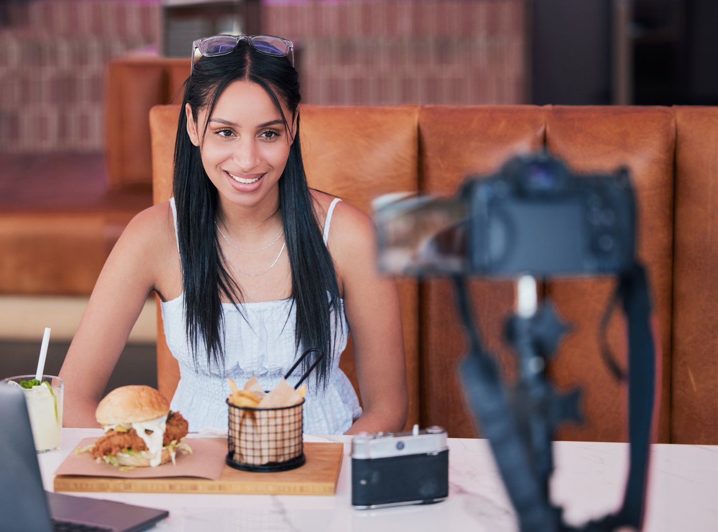 Food Influencer, Internet Speaker at Restaurant with Camera and Recording Cooking Review Social Media Video. Digital Cuisine Web Content Creator or Brand Ambassador Live Streaming to Online Audience.