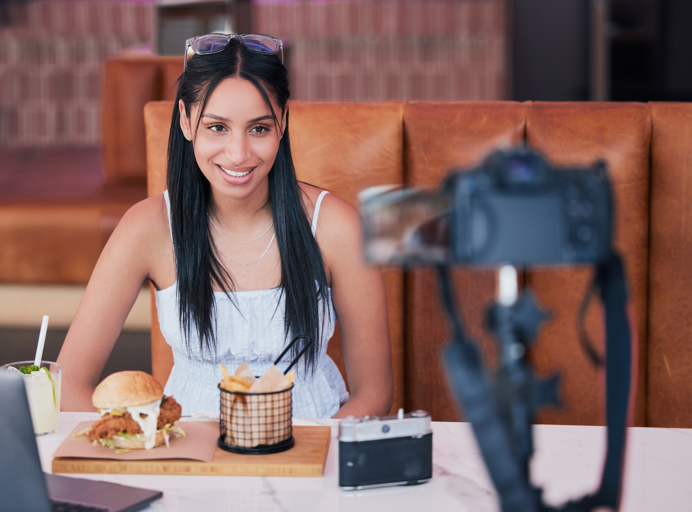 Food Influencer, Internet Speaker at Restaurant with Camera and Recording Cooking Review Social Media Video. Digital Cuisine Web Content Creator or Brand Ambassador Live Streaming to Online Audience.